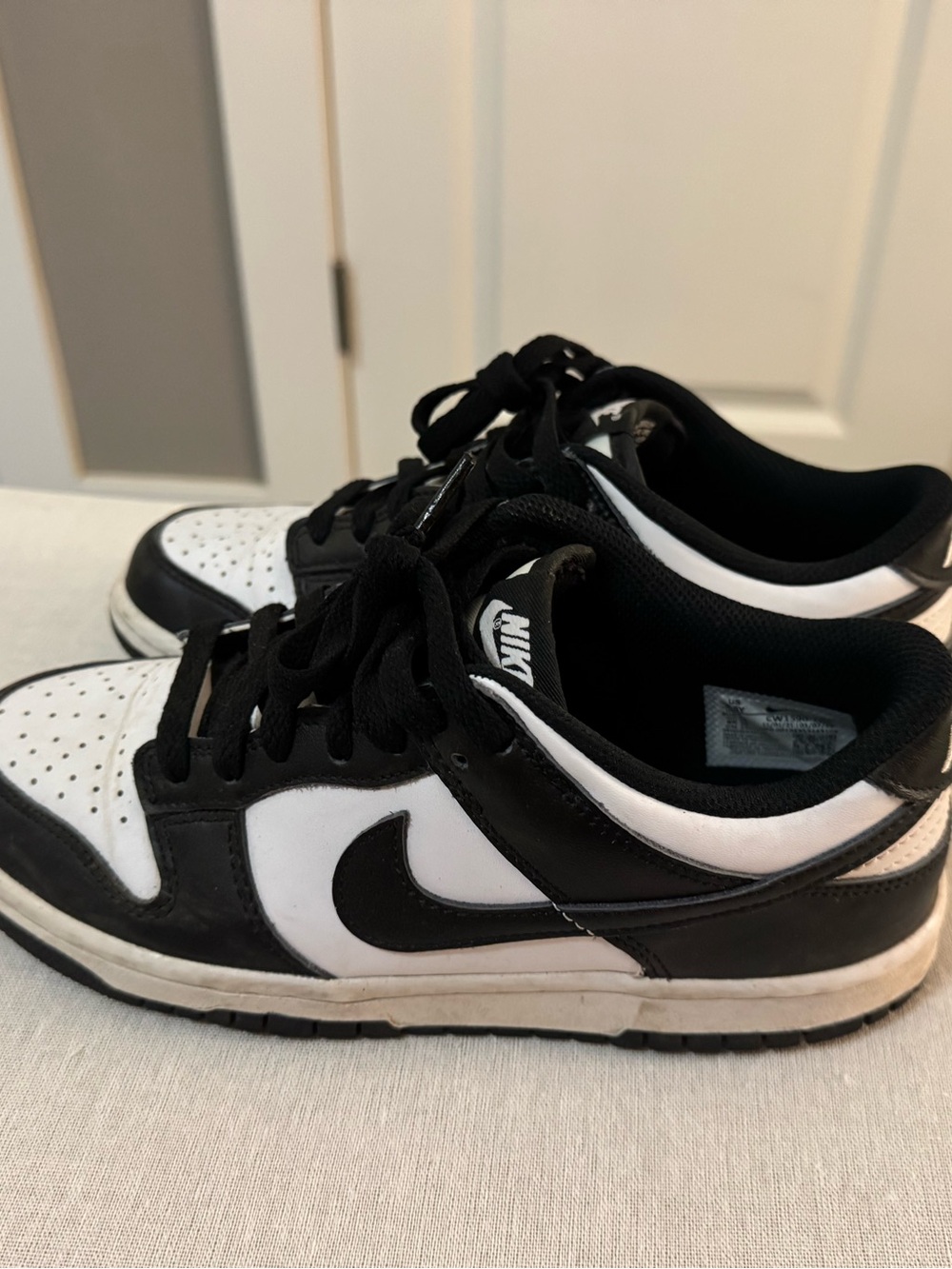 Nike Dunk Low shoes in the popular "Panda" black and white colorway